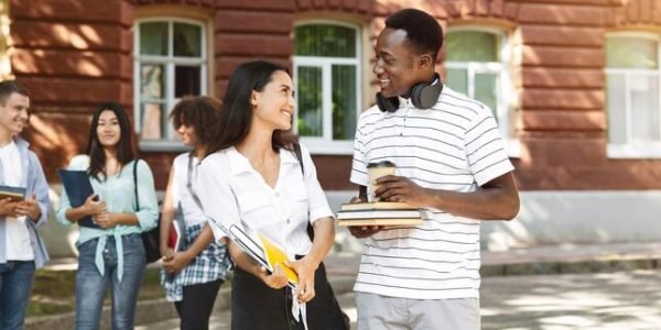 student-couple-having-break-after-study-talking-flirting-outdoors_922936-30977